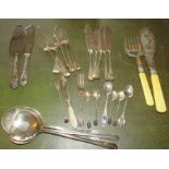 A large group of plated cutlery to include: fish servers, fish knives and forks, cake knife and