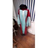 A master's gown 100% wool in claret red with aqua blue trimming and silk taffeta panels running down