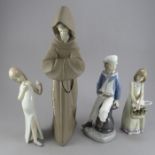 A group of four Lladro porcelain figure groups. To include: a boy with a toy sailing boat, two girls