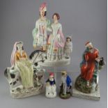A group of Staffordshire figures to include Queen Mary, Albert and the Queen, Elijah and two smaller