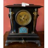 A French ebonised marble, gilt metal and champleve mantel clock, rectangular moulded end top,