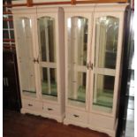 A pair of glazed and mirrored display cabinets. 185 cm tall, 90 cm wide each. (2)