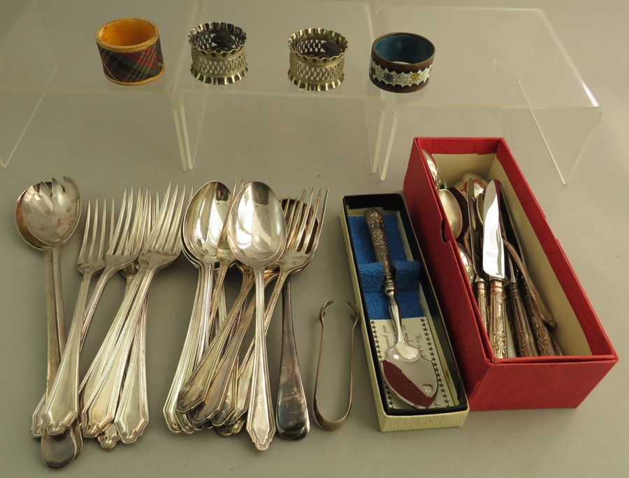 A group of stainless steel and EPNS cutlery and four napkin rings, some boxed. (q)