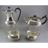 A four-piece plated tea and coffee service with gadrooned edges. Teapot, coffeepot, sugar and
