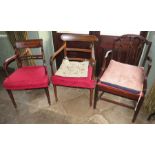 A group of three Victorian mixed mahogany armed chairs and carved work. (3)