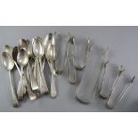 A group of hallmarked of seventeen silver teaspoons and six sugar tongs (23) 375g