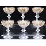 A set of six faceted crystal coupes, with gilt vine decoration, hexagonal bases (6)