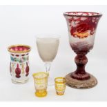 A 19th century Bohemian ruby flash etched chalice, with stags and deer in woodland, on a later