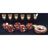 Continental ruby glass cups, saucers and glasses, gilt and jewelled decoration