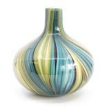 A studio glass vase, in tones of blue, green, brown and white