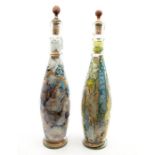 A pair of Victorian style bottle vases filled with souvenir sand