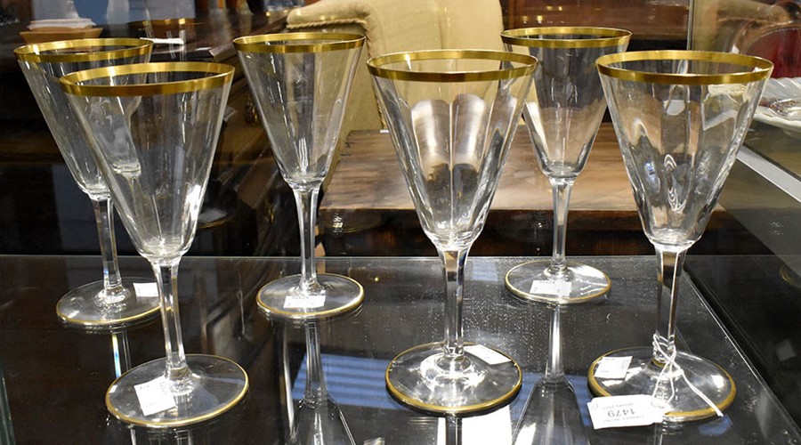 A pair of Edwardian glass ewers, gilt line detail; and a set of six wine glasses (8)