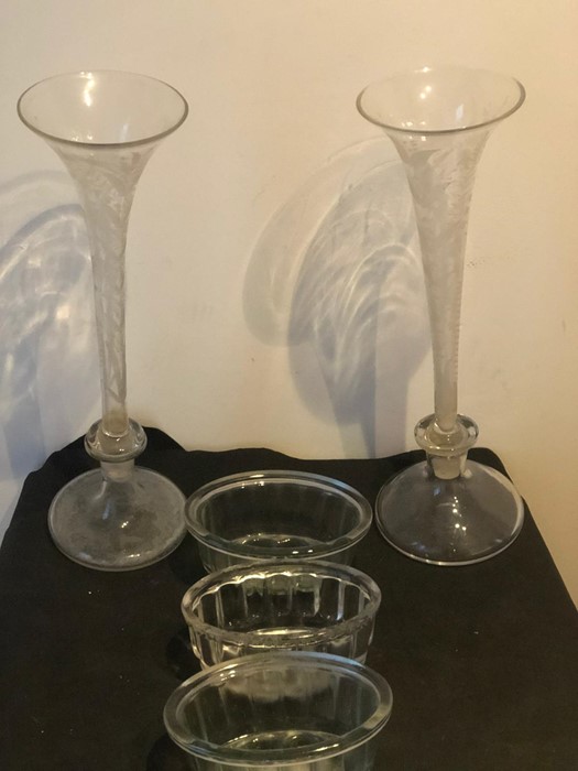 Two 19th century etched glass trumpet shape vases, detachable from base, one base not etched, approx