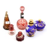 A cut glass ruby flash glass scent bottle and stopper; other scent bottles, pot and cover,