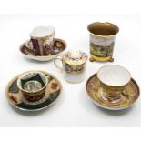 A collection of European ceramics to include: An ornate Cup and Saucer, profuse gilt decoration,
