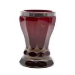 A faceted red glass, with white metal banded rim, hallmarked A.K. 1886