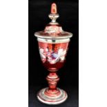 A 19th century Venetian silvered and red coated vase and cover