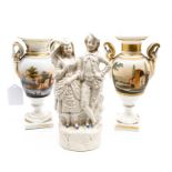 A pair of continental pedestal vases; and a continental figure group (3)