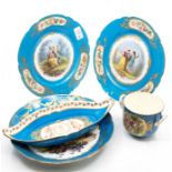 A pair of Sevres plates, painted with figures; another dish painted; a Chateau de Tuileries