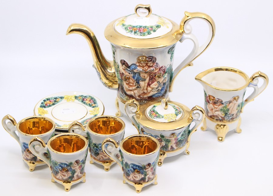 A Capodimonte coffee set for four, including coffee pot, four cups and saucers, milk jug and sugar