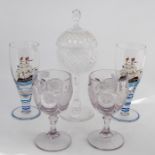 A pair of cut crystal glasses, a cut glass cup and cover; and two glasses painted with tall ships (