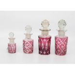 Four graduating ruby flash glass scent bottles