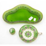 A green glass kidney shaped dish with gilt decoration; and painted and gilded green flash glass cup;