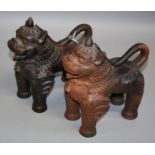 A pair of 20th century terracotta Lion Dogs, each standing fore square with open mouth, 23 x 20cm