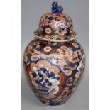 A late 19th century Japanese Imari baluster vase and cover, with kylin finial, decorated with