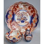 A 19th century Japanese Imari scallop edge charger, typically decorated in the palette, 46cm