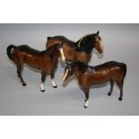 A Beswick Shire mare, number 818, brown gloss glazed, a brown Swish tail horse, number 1182 and