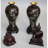 A pair of 20th century Japanese black lacquer baluster vases each with integral stand, decorated