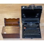 Vintage black Remington typewriter in case, rose mahogany tea caddy and a letter rack