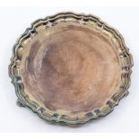 A Georgian style silver card tray, pie crust rim on three scroll feet, by Mappin & Webb,