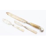 A William IV silver butter knife engraved decoration, carved mother-of-pearl handle, the silver by