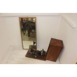 Late 19th Century cased sewing machine and mid 20th Century wall mirror