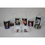 A collection of Elvis Ceramics To Include Elvis Coffee Pot , X2 Elvis Dishes and Five Elvis Mugs.