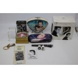 A selection of Elvis memorabilia to include Elvis bedside clock, Paperweight, Cigarette Tin, Pen, 3D