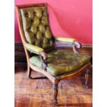A William IV oak framed library armchair, circa 1830, bow top, green studded leather button back
