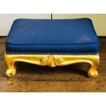 A mid Victorian gilt wood upholstered footstool, circa 1860, serpentine scroll aprons, scroll