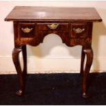 A George III mahogany crossbanded lowboy, circa 1770, in rectangular form above triple oak lined