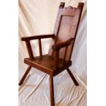An unusual 19th Century oak primitive elbow chair,