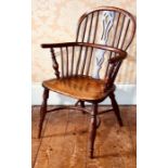 A 19th century elm and yew low back Windsor chair, sparred back centred with pierced vase splat,