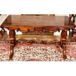 A William IV rosewood writing table, circa 1830, rectangular moulded edge top, above scrolling