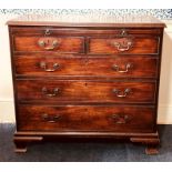 A George III mahogany bachelors chest of drawers, circa 1760, in rectangular form moulded edge, on a