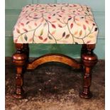 A small oak stool of Carolean design, 19th Century, square with leaf embroidered upholstery, knop