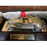 An Elizabeth II sterling silver desk model of a 1932 Rolls-Royce Phantom II Roadster, Magna