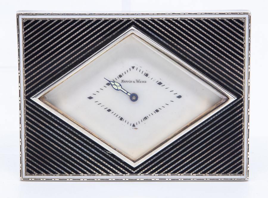 A French Art Deco Mappin & Webb retailed white metal desk or bedside easel timepiece, of rectangular