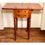 A mid Victorian mahogany work table, circa 1860, drop leaves, two short drawers to one side,