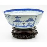 A Chinese blue and white sideboard bowl, Qianlong period, the frieze decorated with a naive figure